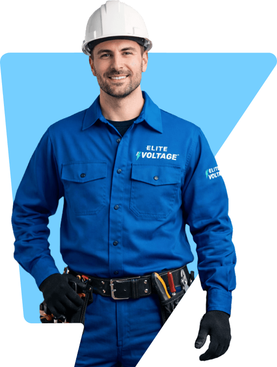 An electrician wearing blue work clothes stands confidently, ready for his tasks.
